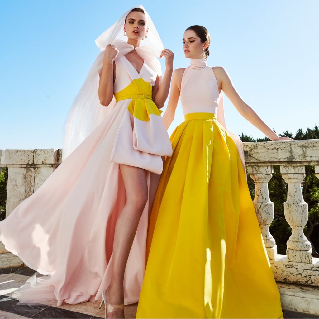 Tulle cape, bicolored long dress, halter-neck crop top and a long ball gown skirt