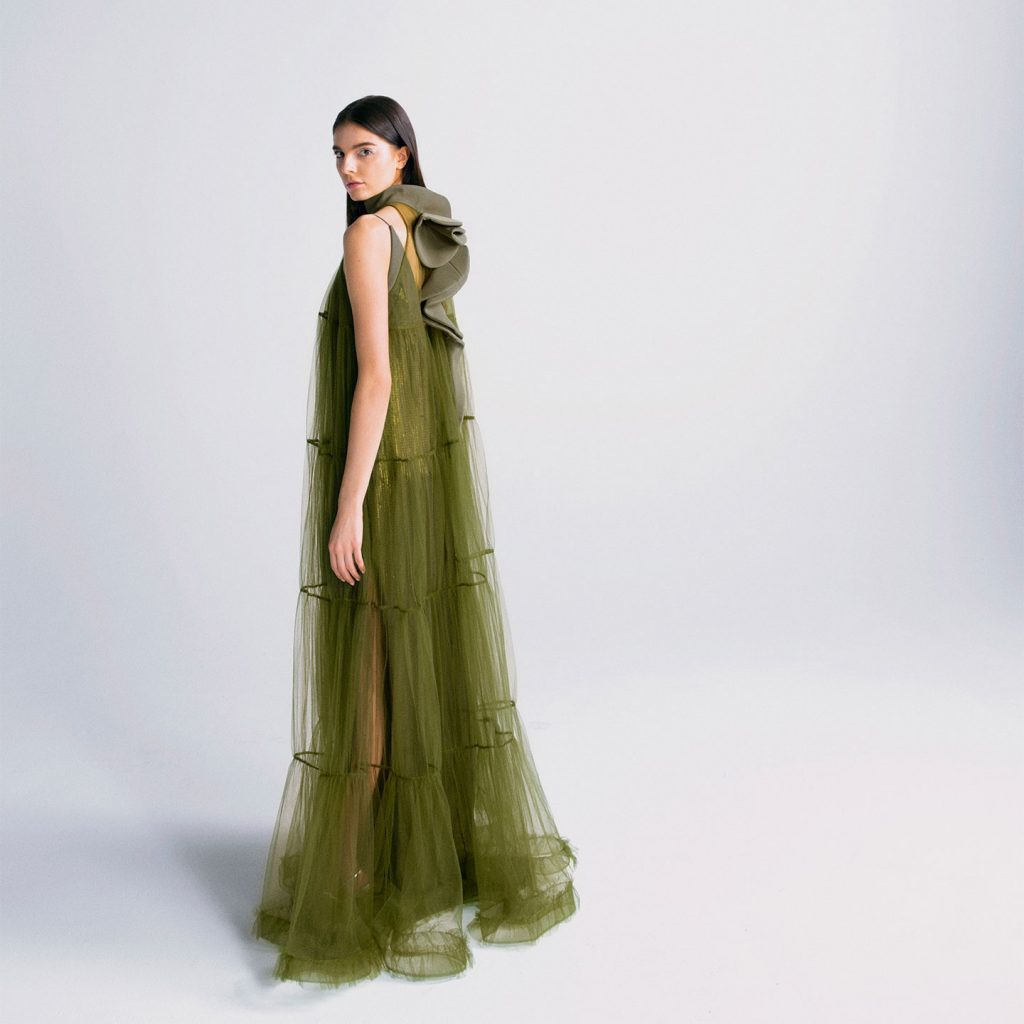 Paillette slip dress with deep V back, and gathered tulle over dress and ruffled volume detail on back.