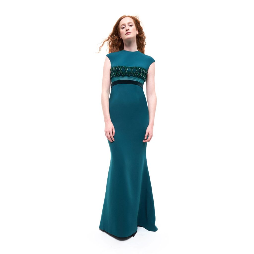 Long dress with cap sleeves and round neck…3d chain metal work applique and sheer corseted detail on bust.