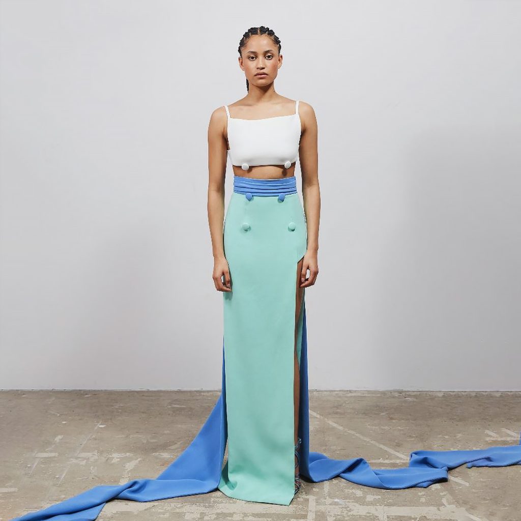 Sleeveless crop top with buttons on bust, and belted bi-colored long skirt with buttons.