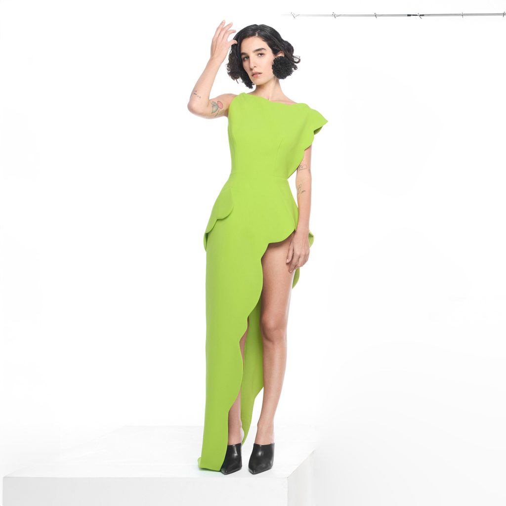 Asymmetrical shoulder ling dress scalloped all over with slit.